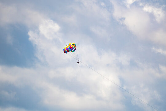 Parasailing adventure above cloudy tropical sky in Costa Rica