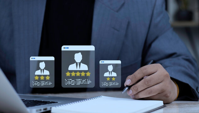 HR specialist writing notes and using laptop computer to assess employee candidate rating holograms. Concept of performance review, job interview assessment, and human resources decision.