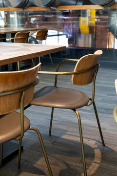Modern food hall seating with wooden chairs and tables