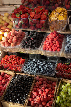 Fresh berry assortment at a vibrant urban food hall