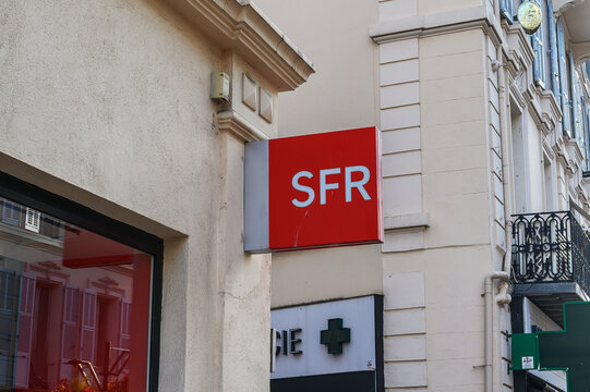 Cannes, France - August 02, 2026: A red SFR sign is prominently displayed on the side of a building facade