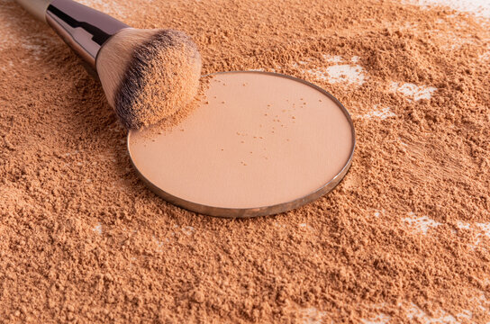 Compact powder makeup with brush on cosmetic powder background