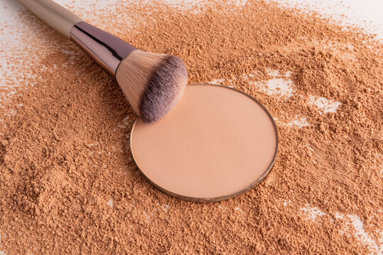 Compact powder refill with makeup brush and powder swatch