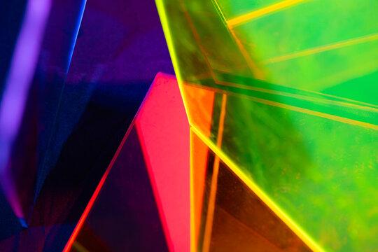 Neon geometric glass panels with vibrant abstract reflections