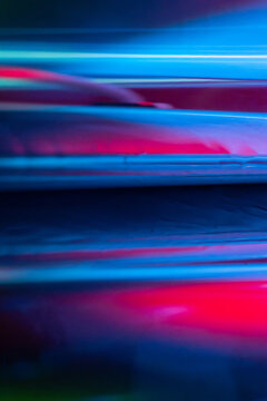 Abstract blue and pink light trails with motion blur
