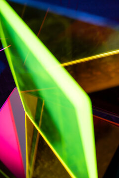 Abstract neon acrylic panels with vibrant geometric reflections