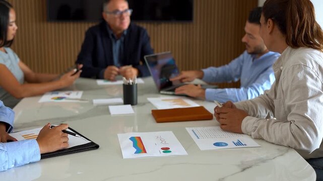 Multi generational business people sharing ideas during team meeting inside modern office - Multiracial colleagues, entrepreneur and corporate concept