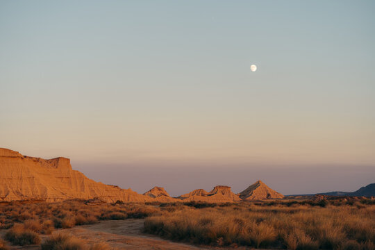 Moonrise over Bardenas Reales desert landscape in Spain