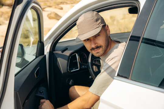 Man exit car in Bardenas Reales desert, Spain