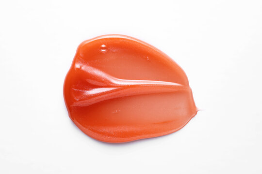 Red lip gloss smear isolated on white background
