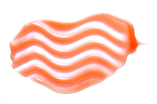 Red lip gloss smear with wavy texture on white background