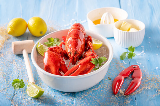 Cooked and tasty lobster served with orange sauce.