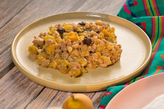 Mexican picadillo with ground meat and fruit for the chiles en nogada filling