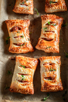 Crispy sausage roll with thyme and sesame seeds.