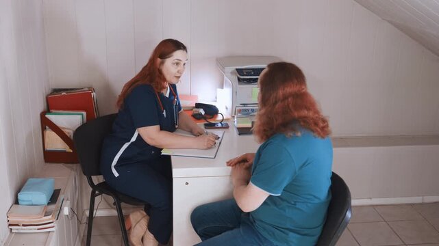 Nurse evaluates patient vitals carefully. Assessment session with nurse and patient details. Friendly nurse conducts athome health evaluation including vital measurements and supportive planning