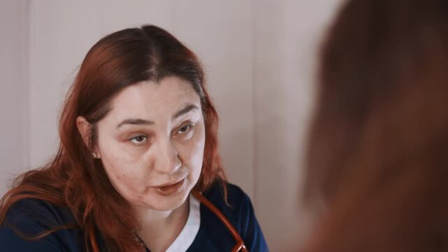 Home paramedic evaluation offering urgent guidance and possible transport coordination mobile clinician in uniform discusses symptoms, explains triage decision, prepares notes and coordinates