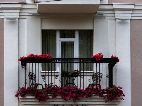 Flowered balcony with wrought iron railing