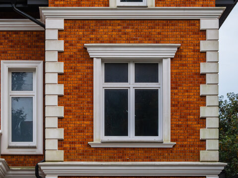 White-trimmed windows on brick facade