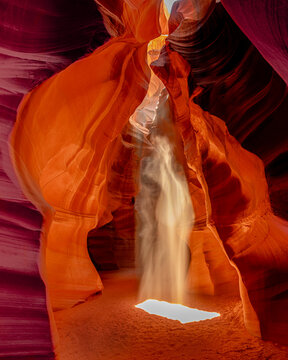 Human Silhouette in Dramatic Sunbeam at Antelope Canyon