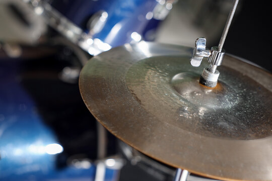 Closeup view of drum set on dark background