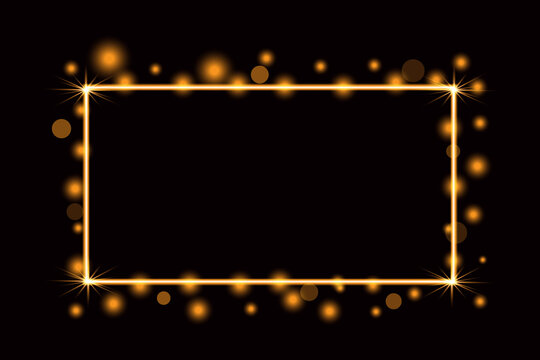 A glowing rectangular frame with golden sparkles and bokeh light effects isolated on a dark black background perfect for luxury invitations or festive holiday