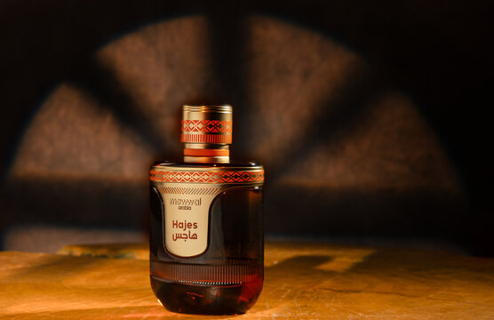 Araras, S&atilde;o Paulo, Brazil. Araras, August 17, 2026. Hajes Perfumes. Lifestyle shot of Haje perfume; dark background and rustic wood, with selective focus.