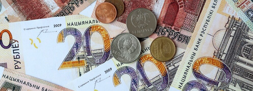 Belarusian ruble money banknotes and coins on table. Belarus cash bills of BYN currency