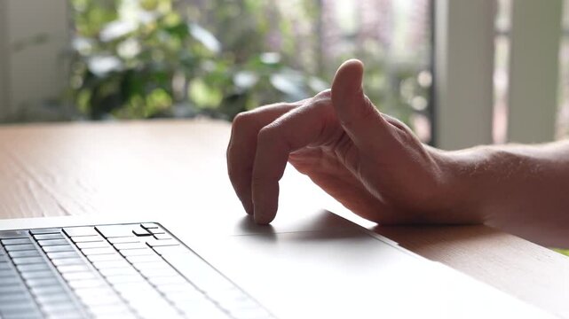 Restless man with ADHD working on laptop at desk nervously tapping fingers at table surface, male with attention deficit syndrome impatiently drumming fingers, ADHD disorder, concentration problems.