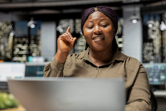 Businesswoman develops a clever idea at night using critical thinking and originality while discovering a possible solution for business growth.