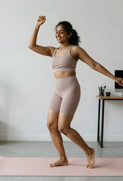 Home fitness and wellness lifestyle, happy woman dancing and exercising in activewear on a yoga mat indoors