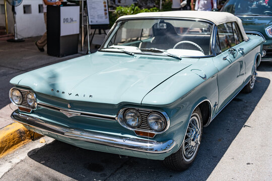 Miami, Florida, USA - May 06, 2025: Chevrolet Corvair 1964 convertible classic car. Luxury convertible car Chevrolet Corvair. Car Chevrolet Corvair parked outdoor. Blue Chevy retro car, corner view