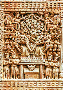Sacred Bodhi Tree (Tree of Enlightenment) above the Vajrasana (Diamond Throne), worshipped by devotees and celestial beings in an aniconic Buddhist relief from Sanchi, Sanchi, India