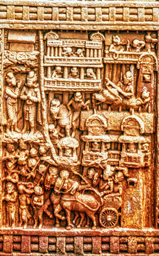 Ancient Buddhist narrative relief depicting an urban settlement with multi-storey buildings, processions, animals, and daily life scenes carved on the Torana of the Great Stupa at Sanchi, Sanchi.