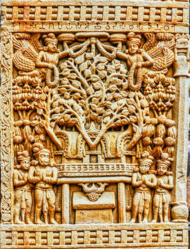 Sacred Bodhi Tree (Tree of Enlightenment) above the Vajrasana (Diamond Throne), worshipped by devotees and celestial beings in an aniconic Buddhist relief from Sanchi, Sanchi, India