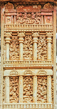 Multi-tiered narrative relief panel depicting palace balconies, courtly life, musicians, dancers, and social gatherings from early Buddhist art on the Sanchi Torana, Sanchi Stupa, India
