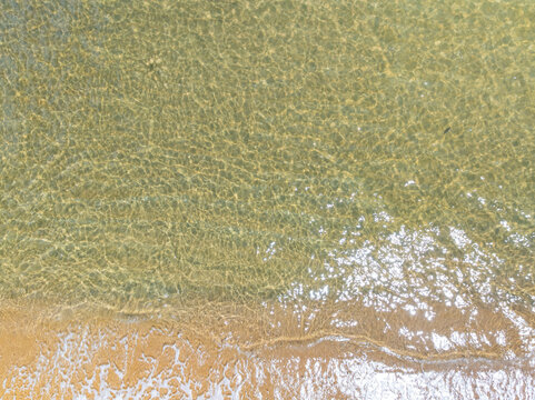 Bird eye view photo of sea beach water surface texture background
