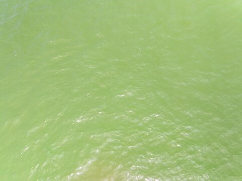 Bird eye view photo of sea beach water surface texture background