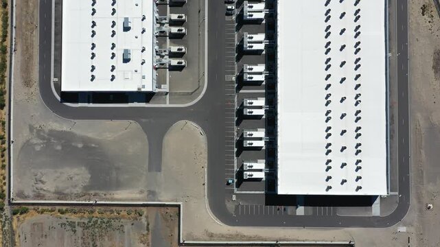 4K aerial drone footage of a hyperscale data center campus of a leading ecommerce and cloud services company near I-84 freeway and the Columbia River in Boardman, Oregon, USA with power substation