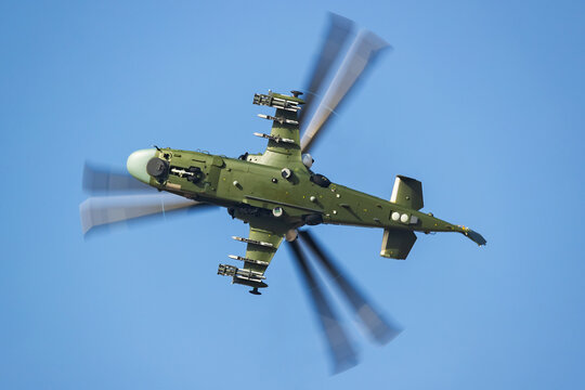 Coaxial-rotor combat helicopter banking during a turn