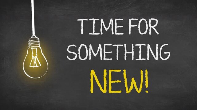  Writing "Time For Something New" with lamp on chalkboard