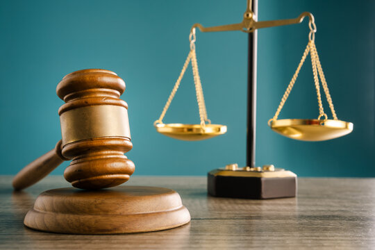 The judge holds the verdict in one hand and the gavel in the other, with scales symbolizing justice, power and legal decision-making.