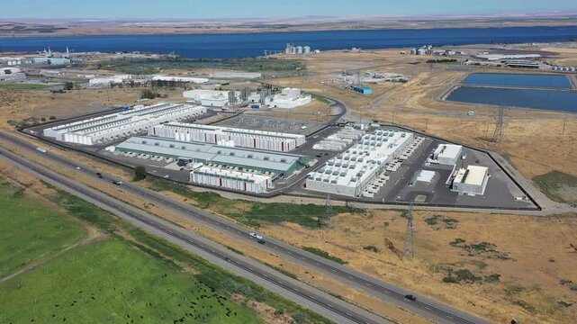 4K aerial drone footage of a hyperscale data center campus of a leading ecommerce and cloud services company near I-84 freeway and the Columbia River in Boardman, Oregon, USA with power substation