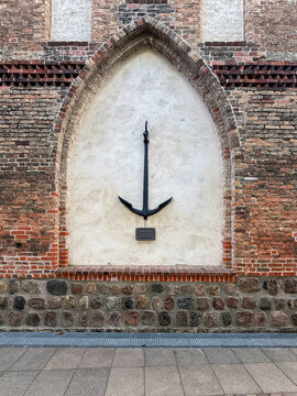 Ship anchor mounted on brick church wall in Eckernf&ouml;rde Germany