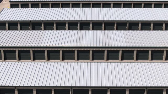 Top-down footage of storage buildings arranged in orderly rows