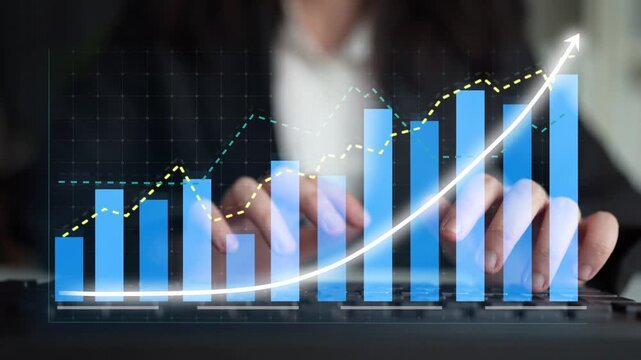 A business professional analyzes growth charts and data trends on a laptop in a modern office. The visual representation showcases progress and insights for impactful decisions. Copula