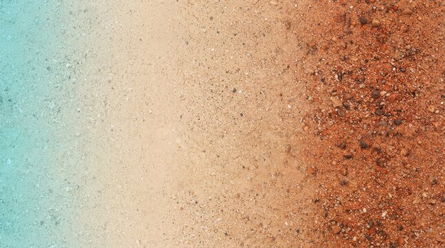 A textured background of sand and dirt with distinct color variation