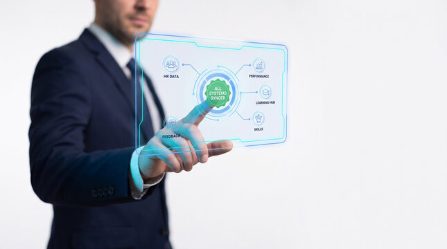 Businessman in a professional suit interacting with a futuristic virtual screen displaying microlearning analytics data and educational performance metrics on a clean white background.