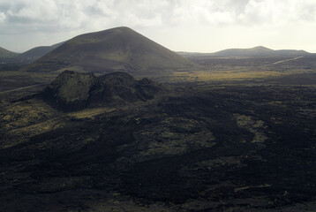 Fototapeta premium Volcanic Cones and Black Lava Fields in Lanzarote, Canary Islands