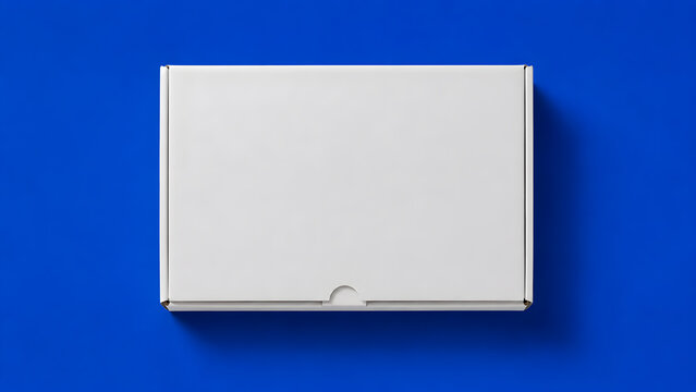 Minimalist white cardboard box packaging on vibrant blue background, product presentation mockup, clean flat lay composition, top view isolated design, modern branding template for e-commerce