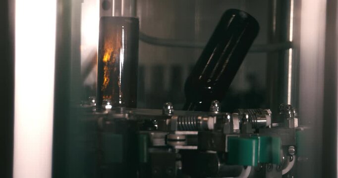 Beer bottles being cleaned before filling in industrial brewery in Berlin